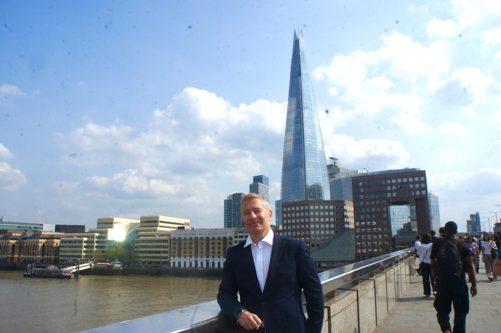 Tim Levene on London Bridge with the Shard behind him